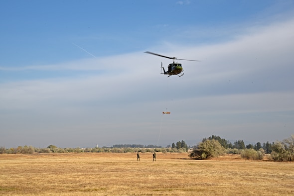 Airmen from the 36th Rescue Squadron demonstrate a medevac situation during the congressional staffer’s base tour Oct. 18, 2018, at Fairchild Air Force Base, Washington. Following the medevac demonstration, congressional staffers were able to speak with 36th RQS aircrew members about their rescue experiences within the Pacific Northwest region. (U.S. Air Force photo/Staff Sgt. Mackenzie Mendez)