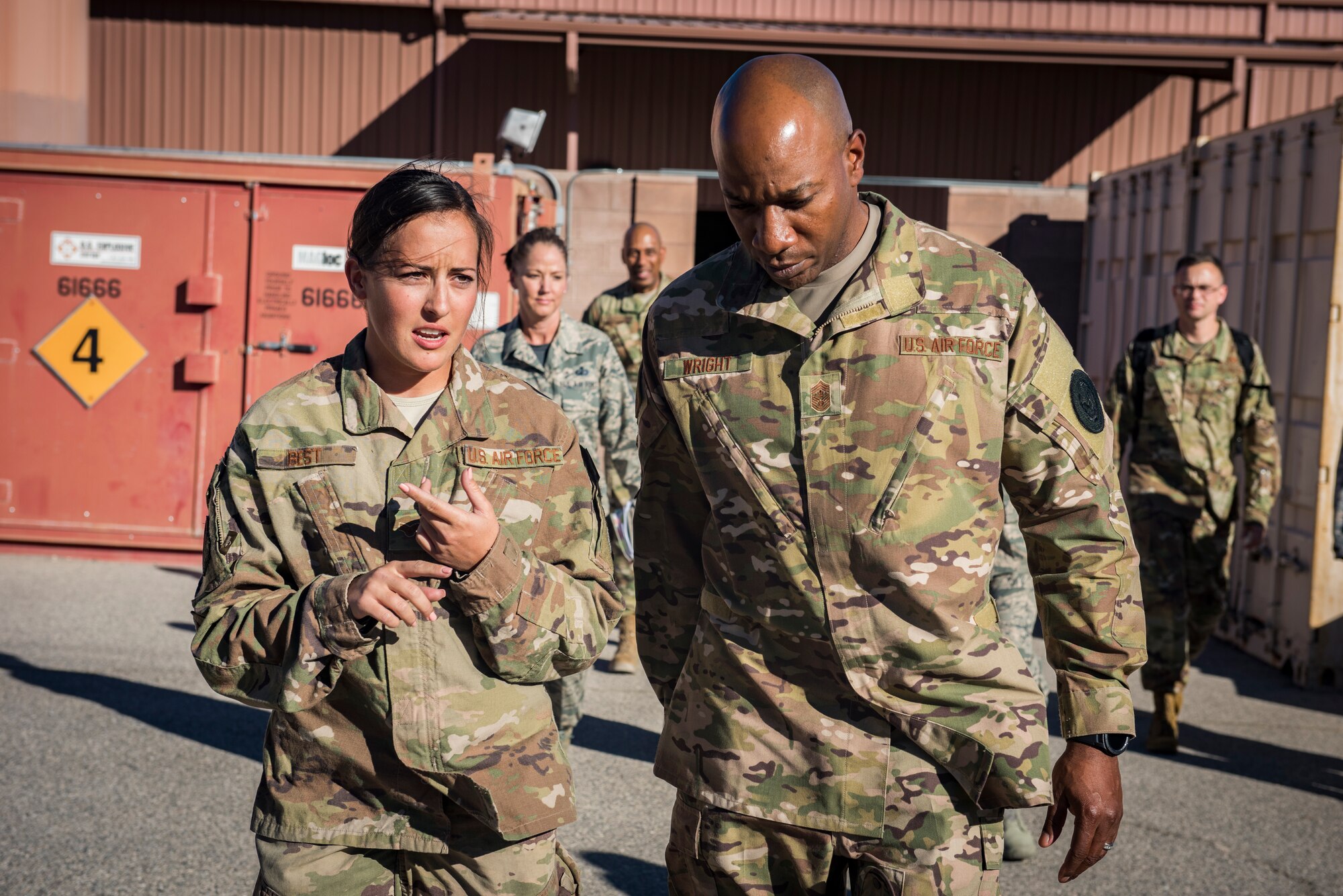 Senior Airman Makayla Best, 823rd Maintenance Squadron HH-60G Pave Hawk helicopter crew chief, briefs Chief Master Sgt. of the Air Force Kaleth O. Wright on the 823rd MXS mission. Wright met with Airmen from all over Nellis to learn about their mission requirements. (U.S. Air Force photo by Airman 1st Class Andrew D. Sarver)