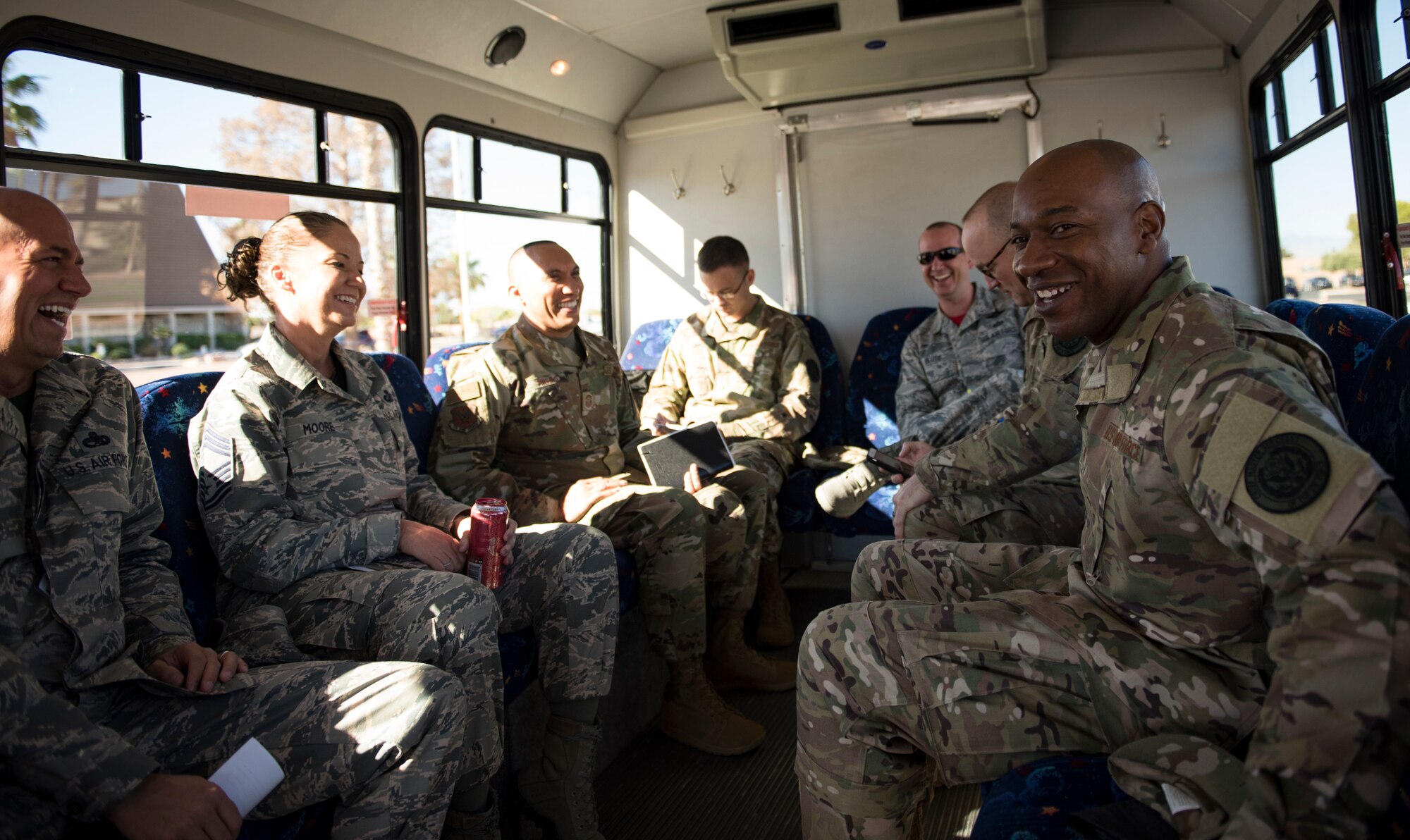 Chief Master Sgt. of the Air Force Kaleth O. Wright shares a laugh with base leadership during a tour Oct. 19, 2018, at Nellis Air Force Base, Nevada. Wright and his team traveled to multiple units across Nellis AFB to meet Airmen and learn about the different roles and responsivities that they have. (U.S. Air Force photo by Airman 1st Class Andrew D. Sarver)