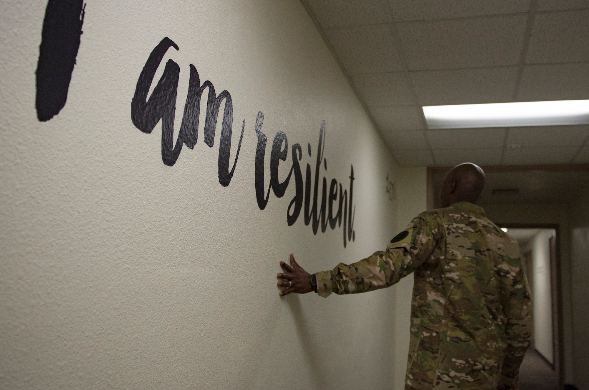 Chief Master Sgt. of the Air Force Kaleth O. Wright walks down a hallway before meeting with master resiliency trainers Oct. 19, 2018, at Nellis Air Force Base. Wright met with more than a dozen MRTs during his visit to Nellis. (U.S. Air Force photo by Airman 1st Class Andrew D. Sarver)