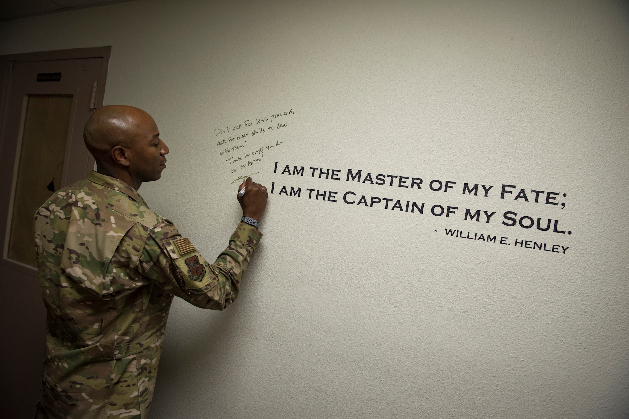 Chief Master Sgt. of the Air Force Kaleth O. Wright signs an excerpt from the poem ‘Invictus’ by William Earnest Henley after meeting with master resiliency trainers Oct. 19, 2018, at Nellis Air Force Base, Nevada. As one of Wright’s favorite poems, Nellis MRTs asked him to sign it before leaving. He wrote, “Don’t ask for less problems, ask for more skills to deal with them! Thanks for everything you do for our Airmen!” (U.S. Air Force photo by Airman 1st Class Andrew D. Sarver)