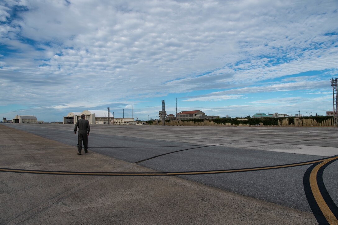 Lt. Gen. Jerry Martinez, U.S. Forces, Japan and 5th Air Force commander, observes the flight line from an air traffic control tower Oct. 16, 2018, at Kadena Air Base, Japan. Martinez visited Kadena Air Base with Chief Master Sgt. Terrence Greene, USFJ and 5th Air Force command chief, to observe the mission and engage the Airmen, spouses, and families of Team Kadena.  (U.S. Air Force photo by Senior Airman Kristan Campbell)