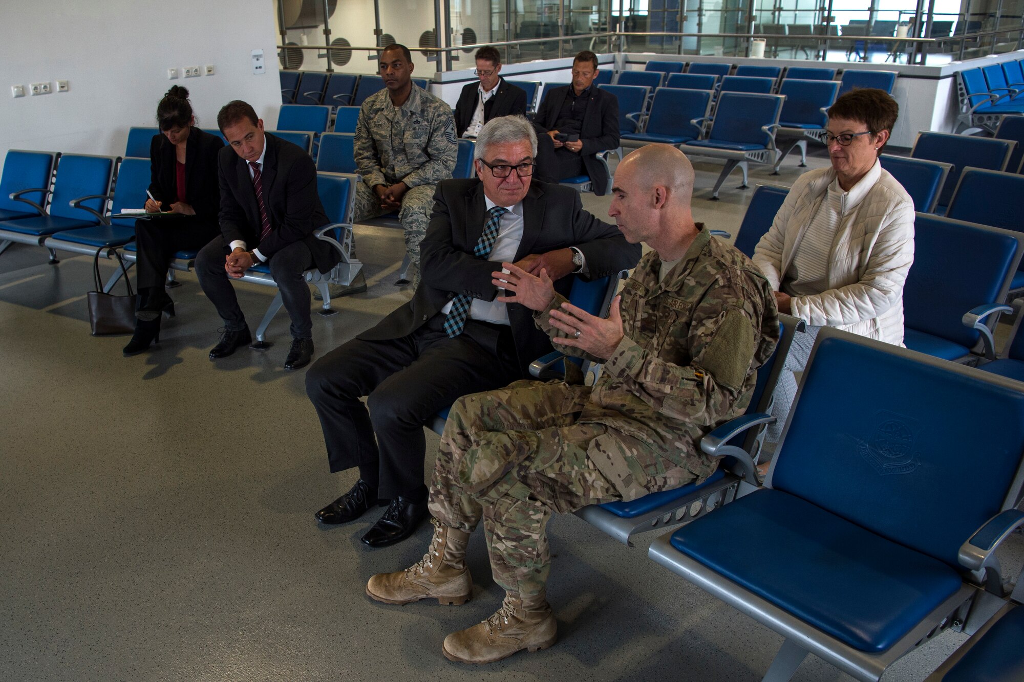 U.S. Air Force Col. Jason Bailey, 52nd Fighter Wing commander, center right, speaks with Roger Lewentz, Minister of the Interior of Rhineland-Palatinate, Germany, center, in the passenger terminal at Spangdahlem Air Base, Germany, Oct. 22, 2018. Lewentz was provided a base tour and mission brief. Bailey discussed the importance of Spangdahlem AB's mission in Europe. (U.S. Air Force photo by Airman 1st Class Valerie Seelye)