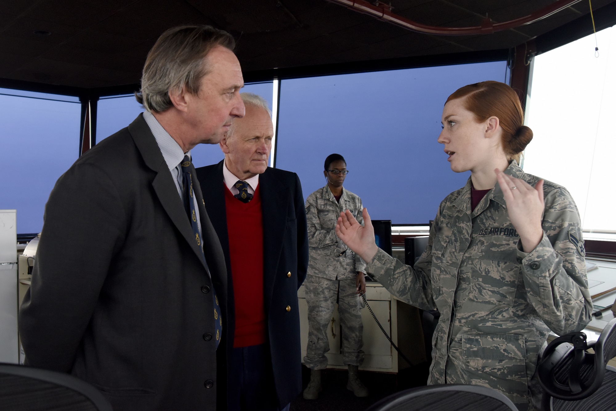 A 48th Operations Support Squadron aircraft traffic controller, describes ATC operations to George Vestey, High Sheriff of Suffolk, and Charles Watt, High Sheriff of Norfolk, at Royal Air Force Lakenheath, England, Oct. 19, 2018. Vestey and Watt spoke to and engaged with Liberty Wing Airmen about their duties and how they support the 48th Fighter Wing mission. (U.S. Air Force Photo/ Senior Airman John A. Crawford)