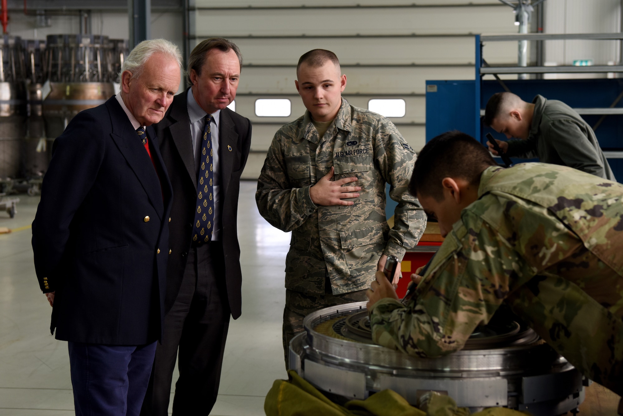 48th Component Maintenance Squadron aerospace propulsion technicians demonstrate an engine inspection to Charles Watt, High Sheriff of Norfolk and George Vestey, High Sheriff of Suffolk, at Royal Air Force Lakenheath, England, Oct. 19, 2018. Vestey and Watt were shown the ins-and-outs of the Liberty Wing’s mission to strengthen relationships through education.  (U.S. Air Force Photo/ Senior Airman John A. Crawford)