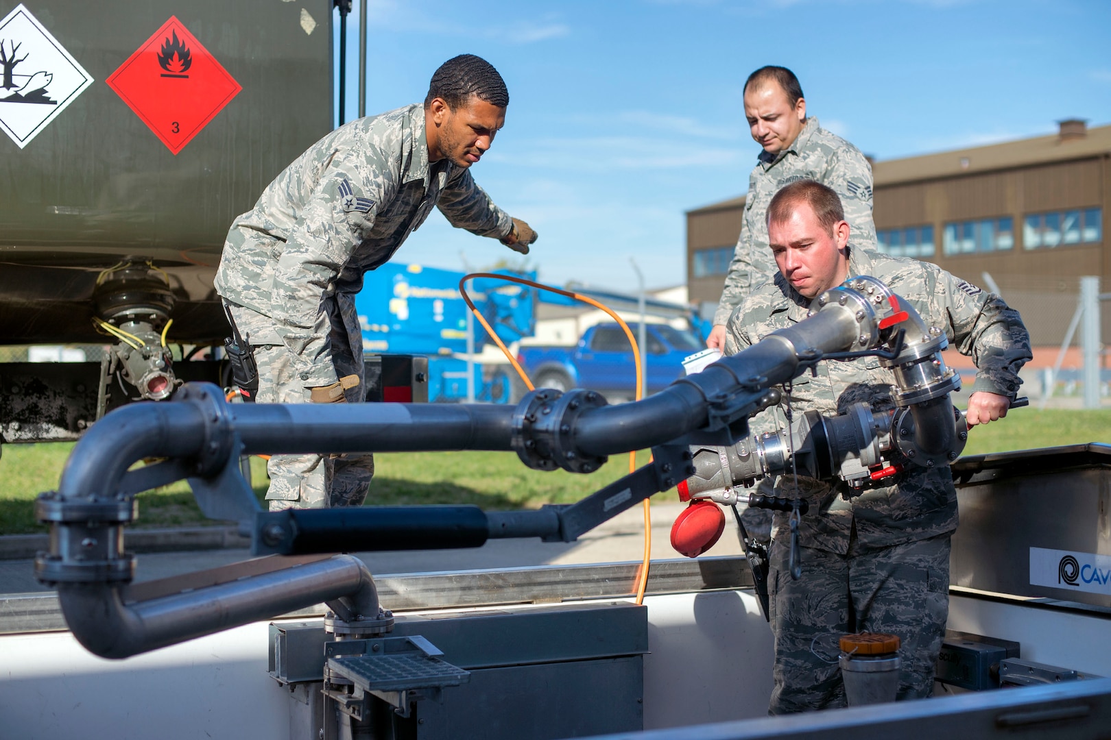 U.S. Air Force Airmen from 100th Logistics Readiness Squadron petroleum, oil and lubricants flight prepare to fill up a fuel truck at RAF Mildenhall, England, Oct. 9, 2018. The flight consists of multiples sections that aid in fueling home station and transient aircraft. (U.S. Air Force photo by Staff Sgt. Christine Groening)