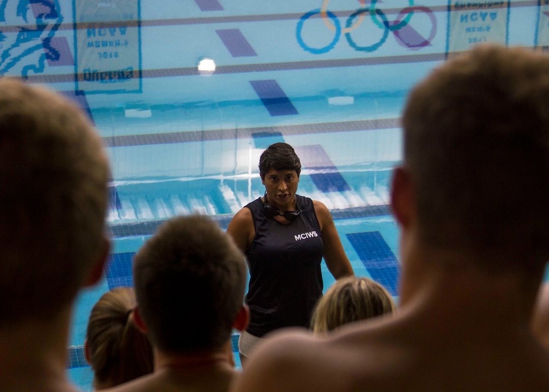 U.S. Marine Corps Staff Sgt. Dary Selgren, a drill instructor with Recruit Training Regiment, Marine Corps Recruit Depot Parris Island, South Carolina, speaks to the Queens University Swim Team during a Marine Corps water survival demonstration as part of Marine Week Charlotte, Sept. 6, 2018. Selgren is a native of Oviedo, Florida. Marine Week Charlotte is an opportunity for the people of the greater Charlotte area to meet Marines and learn about the Corps’ history, traditions and value to the nation. (U.S. Marine Corps photo by Lance Cpl. Jack A. E. Rigsby)