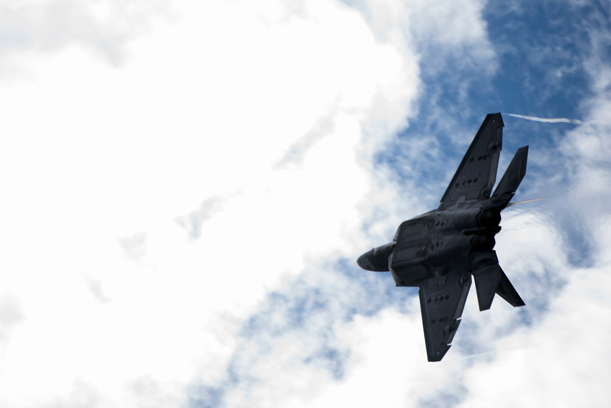 An F-22 Raptor assigned to the 1st Fighter Wing, Joint Base Langley-Eustis, Va. banks prior to landing at Royal Air Force Lakenheath, England Oct. 9, 2018. The Raptors are training with U.S. allies and partners as a demonstration of U.S. commitment to European regional security. (U.S. Air Force photo/Senior Airman Malcolm Mayfield)