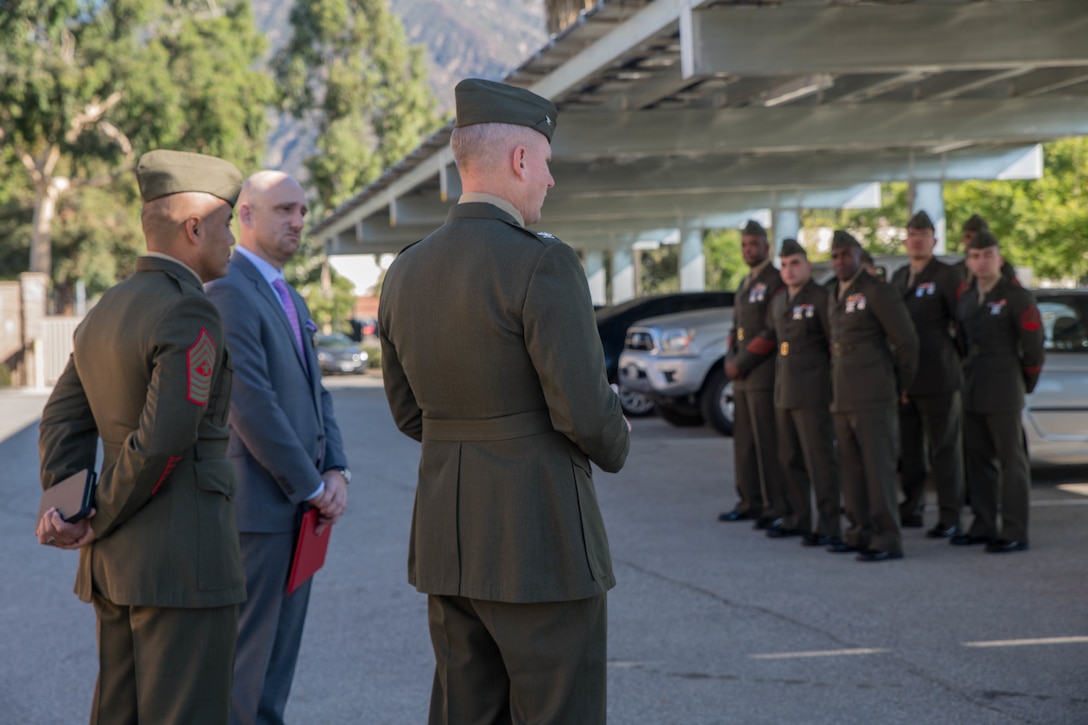 Col. Justin J. Anderson, battalion Inspector Instructor for 2nd Battalion, 23rd Marine Regiment, 4th Marine Division (center) speaks to the Marines, family and friends of Marine veteran Matthew R. Follett after he is presented with the Purple Heart in Pasadena, Calif. on October 19, 2018. SSgt Follett received the award for injuries sustained while serving as an active duty counter intelligence specialist with 3rd Battalion, 4th Marine Regiment, 1st Marine Division, on January 7, 2010. (U.S.  Marine Corps photo by Lance Cpl. Samantha Schwoch/released)