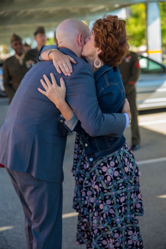 Marine veteran Matthew R. Follett (right) is congratulated by his mother, Betty Roy (left), after he was presented with a Purple Heart in Pasadena, Calif. on October 19, 2018. SSgt Follett received the award for injuries sustained while serving as an active duty counter intelligence specialist with 3rd Battalion, 4th Marine Regiment, 1st Marine Division, on January 7, 2010. (U.S.  Marine Corps photo by Lance Cpl. Samantha Schwoch/released)