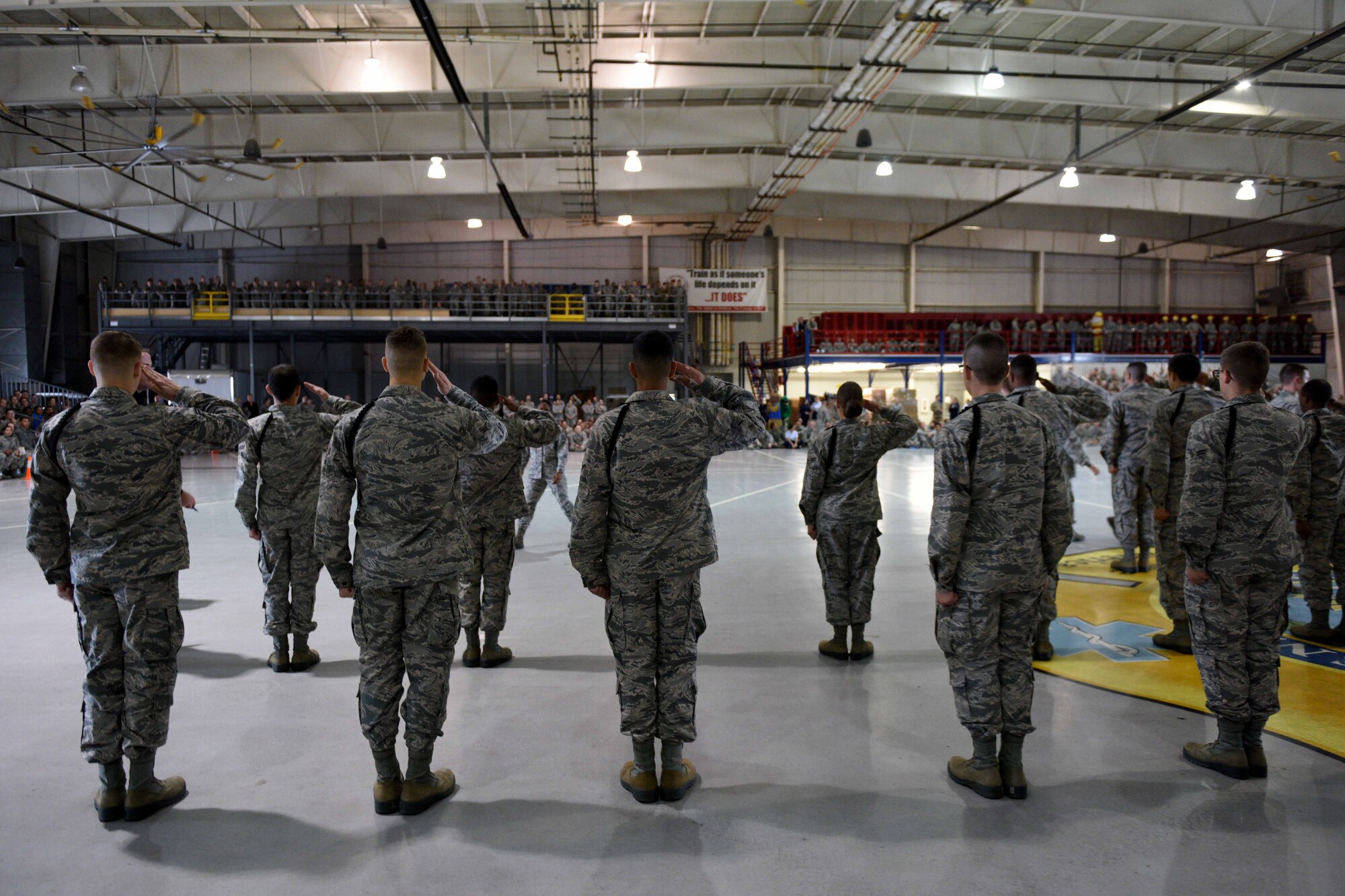 Airmen compete in an elimination drill during the quarterly drill competition at the Louis F. Garland Department of Defense Fire Academy on Goodfellow Air Force Base, Texas, Oct. 19, 2018. The competitors had to respond to drill commands or the judges would eliminate them. (U.S. Air Force photo by Senior Airman Randall Moose/Released)