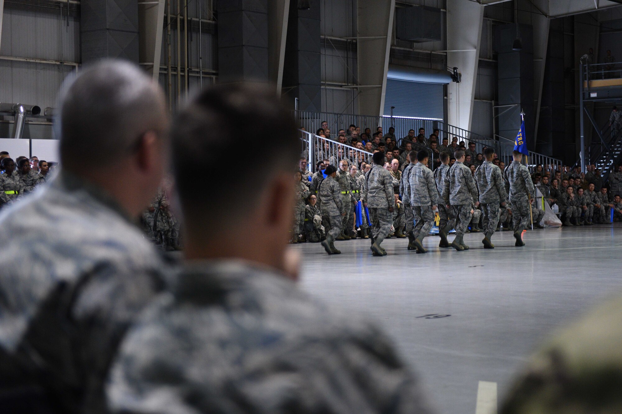 U.S. Air Force Chief Master Sgt. Daniel Stein, 17th Training Group superintendent, and Col. Thomas Coakley, 17th TRG commander, watch the quarterly drill competition at the Louis F. Garland Department of Defense Fire Academy on Goodfellow Air Force Base, Texas, Oct. 19, 2018. Leadership, including squadron commanders, came out to celebrate and cheer for their squadrons. (U.S. Air Force photo by Senior Airman Randall Moose/Released)
