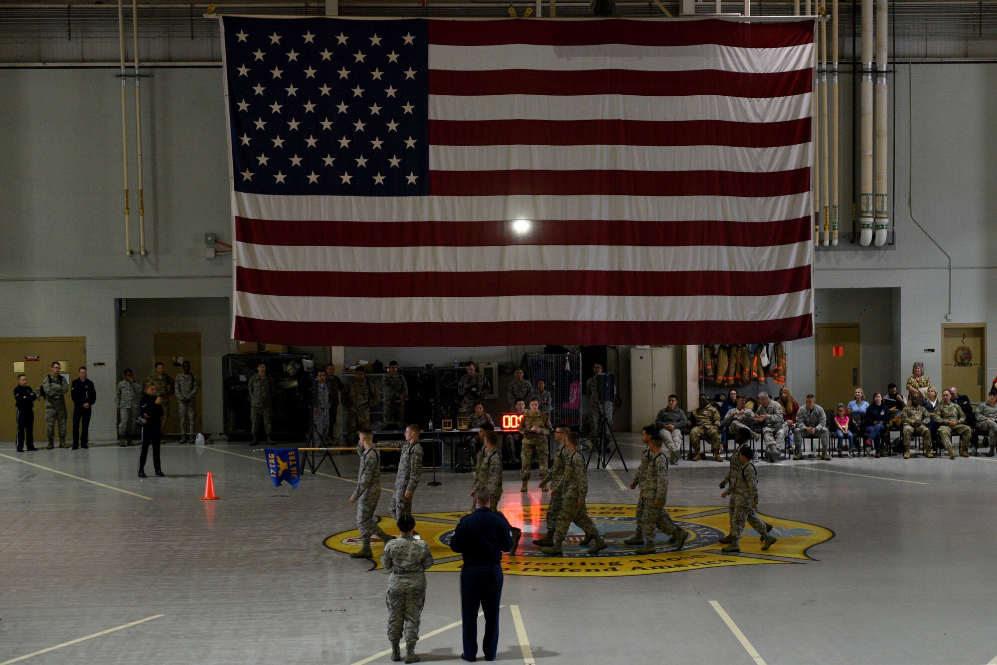 Airmen from the 316th Training Squadron perform regulation drill during the quarterly drill competition at the Louis F. Garland Department of Defense Fire Academy on Goodfellow Air Force Base, Texas, Oct. 19, 2018. The Airmen performed marching maneuvers such as “eyes right,” Airmen use this maneuver to acknowledge the reviewing officer during a parade. (U.S. Air Force photo by Senior Airman Randall Moose/Released)