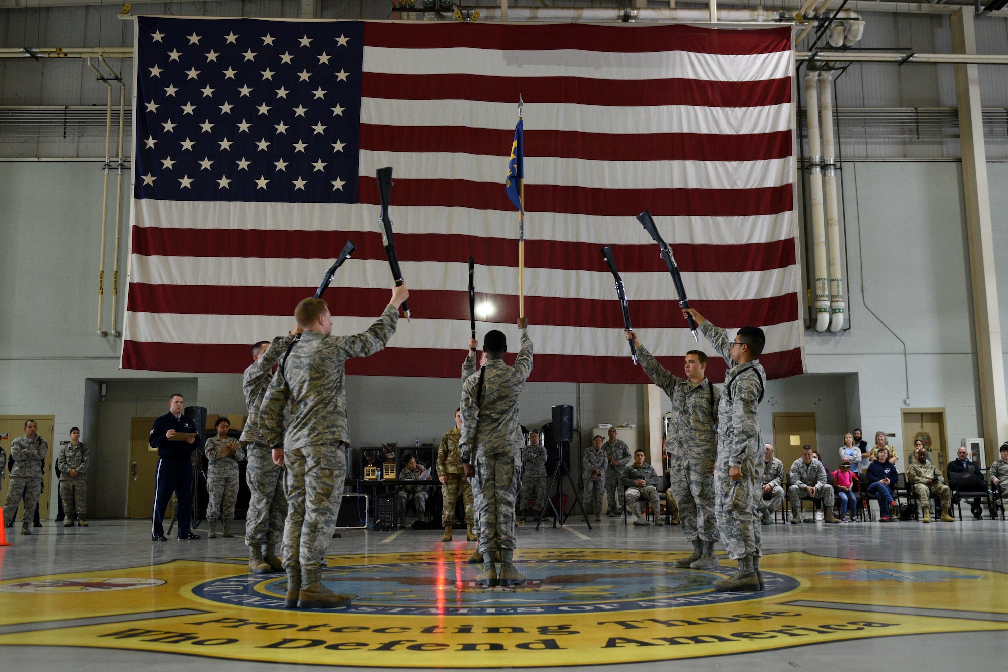 Airmen form the 312th Training Squadron perform an exhibition drill during the quarterly drill competition at the Louis F. Garland Department of Defense Fire Academy on Goodfellow Air Force Base, Texas, Oct. 19, 2018. Each squadron displayed their exhibition drill, using creative, free-form drill maneuvers. (U.S. Air Force photo by Senior Airman Randall Moose/Released)