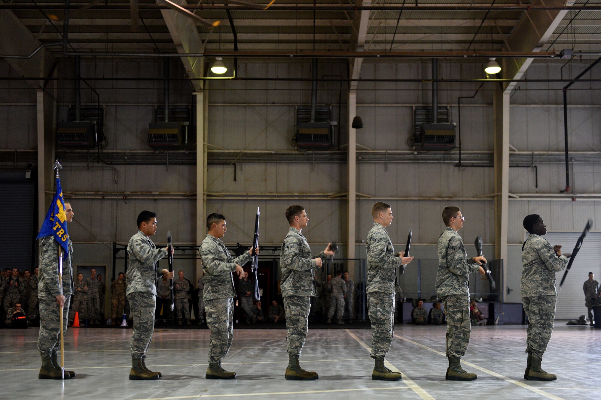 Airmen from the 316th Training Squadron perform an exhibition drill during the quarterly drill competition at the Louis F. Garland Department of Defense Fire Academy on Goodfellow Air Force Base, Texas, Oct. 19, 2018. To win the regulation drill segment of the competition the team has to show discipline, precision and unity. (U.S. Air Force photo by Senior Airman Randall Moose/Released)