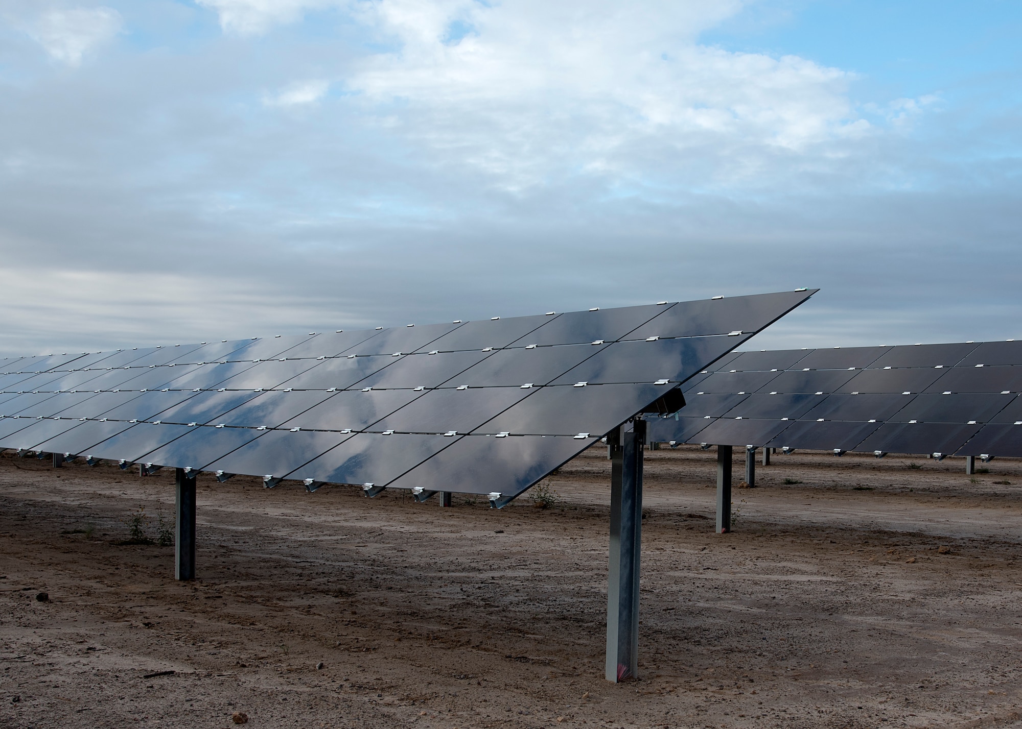 the first major solar array, encompassing 42 acres, opened Oct. 19 on Holloman Air Force Base, N.M. Over 1,300 facilities on-base will be powered by the array, meeting 50 percent of the base's summer day-time demand and 100 percent of the winter day-time demand. (U.S. Air Force photo by Airman 1st Class Kindra Stewart)