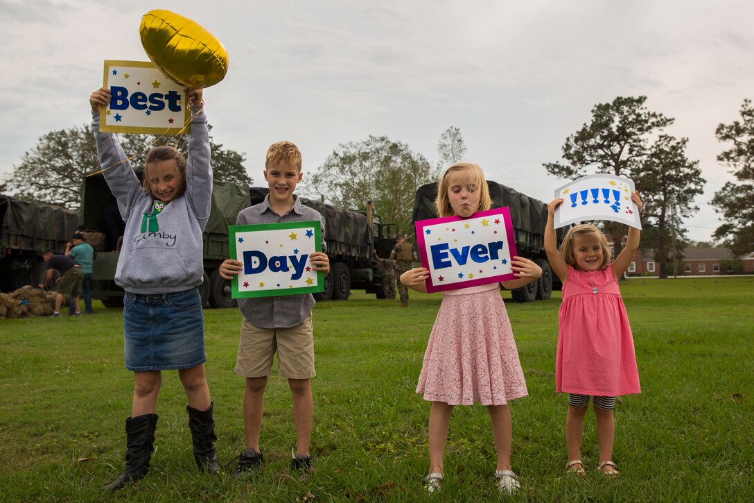 Friends and family of Marines and Sailors with Special Purpose Marine Air-Ground Task Force-Crisis Response-Africa wait for their return during a homecoming at Camp Lejeune, N.C., Oct. 20, 2018. Marines and Sailors with SPMAGTF-CR-AF returned home from a seven-month deployment after conducting crisis-response and theater-security operations in Europe and Africa. (U.S. Marine Corps photo by Lance Cpl. Larisa Chavez)