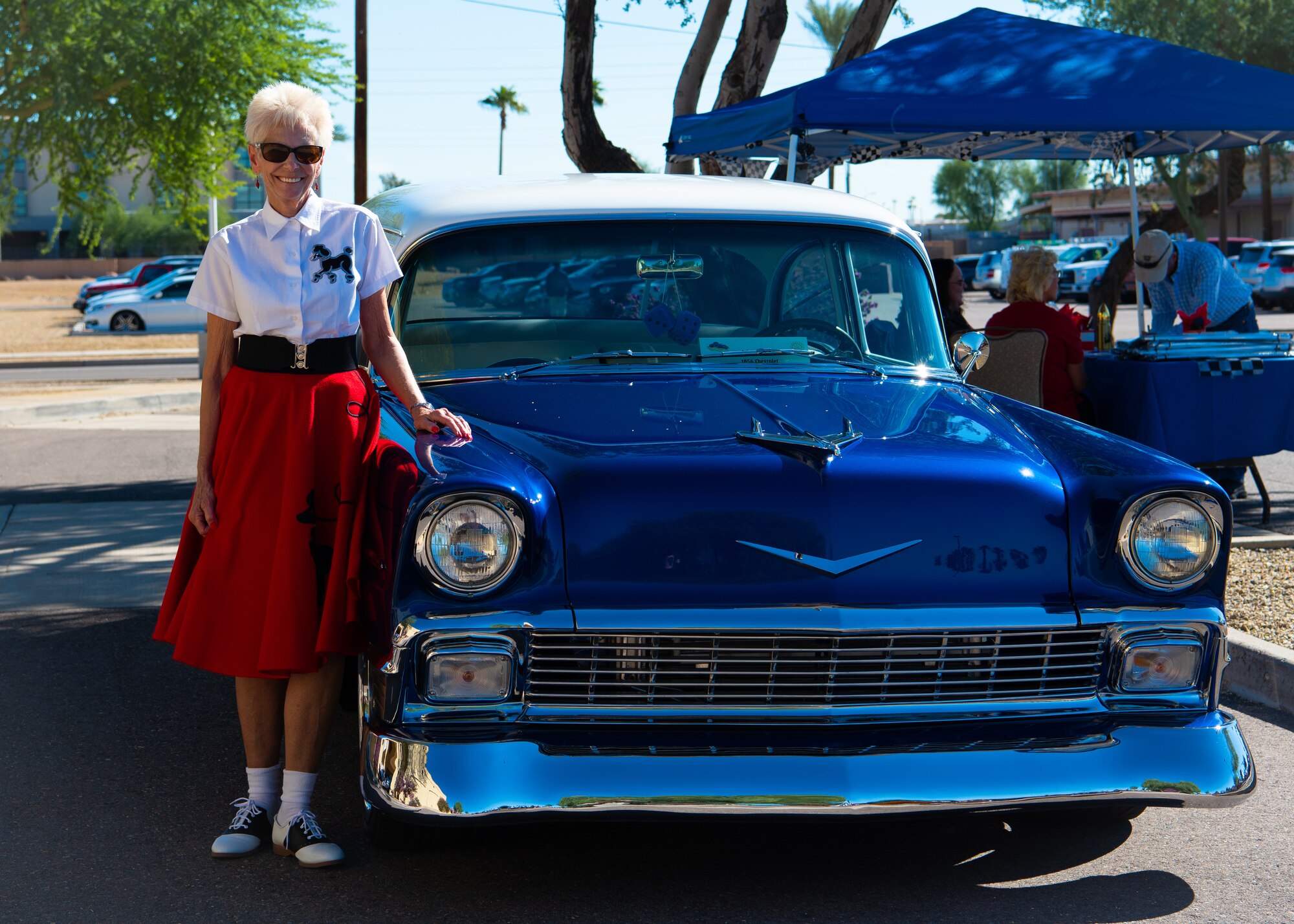 A “Tune up for Health” health fair and car show participant stands next to her car, Oct. 19, 2018 at Luke Air Force Base, Ariz.
