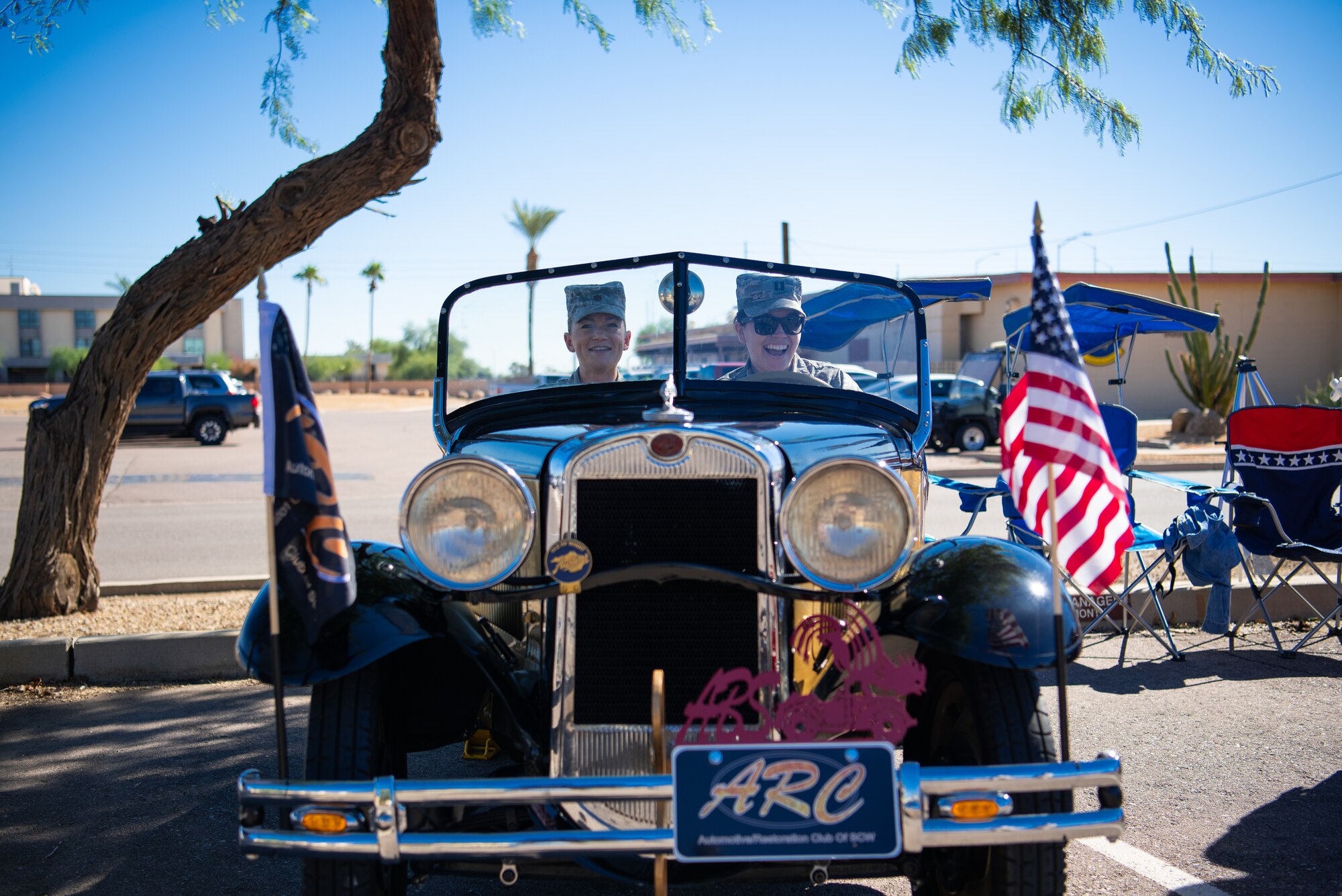 Officers assigned to the 56th Fighter Wing enjoy the some of the cars during the “Tune up for health” event, Oct. 19, 2018 at Luke Air Force Base, Ariz.