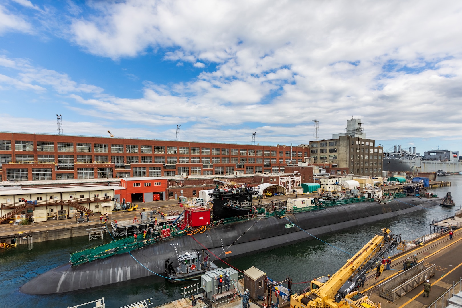 Shipyard personnel and ship’s force work together to undock USS Maine (SSBN 741) on June 26, 2018.