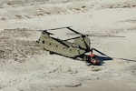 A New York Army National Guard CH-47 Chinook helicopter transports search and rescue personnel and their all-terrain vehicles to St. Teresa, along the shoreline of the Florida panhandle, Oct. 12, 2018. The New York Army National Guard Soldiers deployed two Chinooks and two UH-60 Black Hawk helicopters along with 25 crew members to Tallahassee, Florida, to assist with response and recovery efforts for the Florida National Guard following the impact of Hurricane Michael.