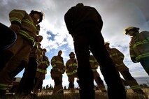 Schriever Fire Department firefighters discuss their plan of action during Opinicus Vista 18-2 at Schriever Air Force Base, Colorado, Oct. 17, 2018. Exercises are conducted regularly to test the base's response to emergency situations. The 50th Space Wing Inspector General's office members evaluated emergency responders and offered feedback following the exercise.  (U.S. Air Force Photo by Dennis Rogers)