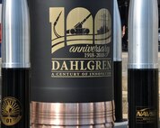 IMAGE: DAHLGREN, Va. (Oct. 19, 2018) – The time capsule at the Naval Surface Warfare Center Dahlgren Division (NSWCDD) centennial grand finale. As participants celebrated Dahlgren’s impact upon the Navy and nation, the time capsule – ten 105 millimeter shells surrounding a 16-inch shell –  was unveiled and all in attendance had the opportunity to write notes and share their thoughts with future generations. Dahlgren personnel can write notes to be placed inside the capsule until the end of 2018 when it will be sealed and opened on Oct. 16, 2068 at the command’s 150th anniversary.