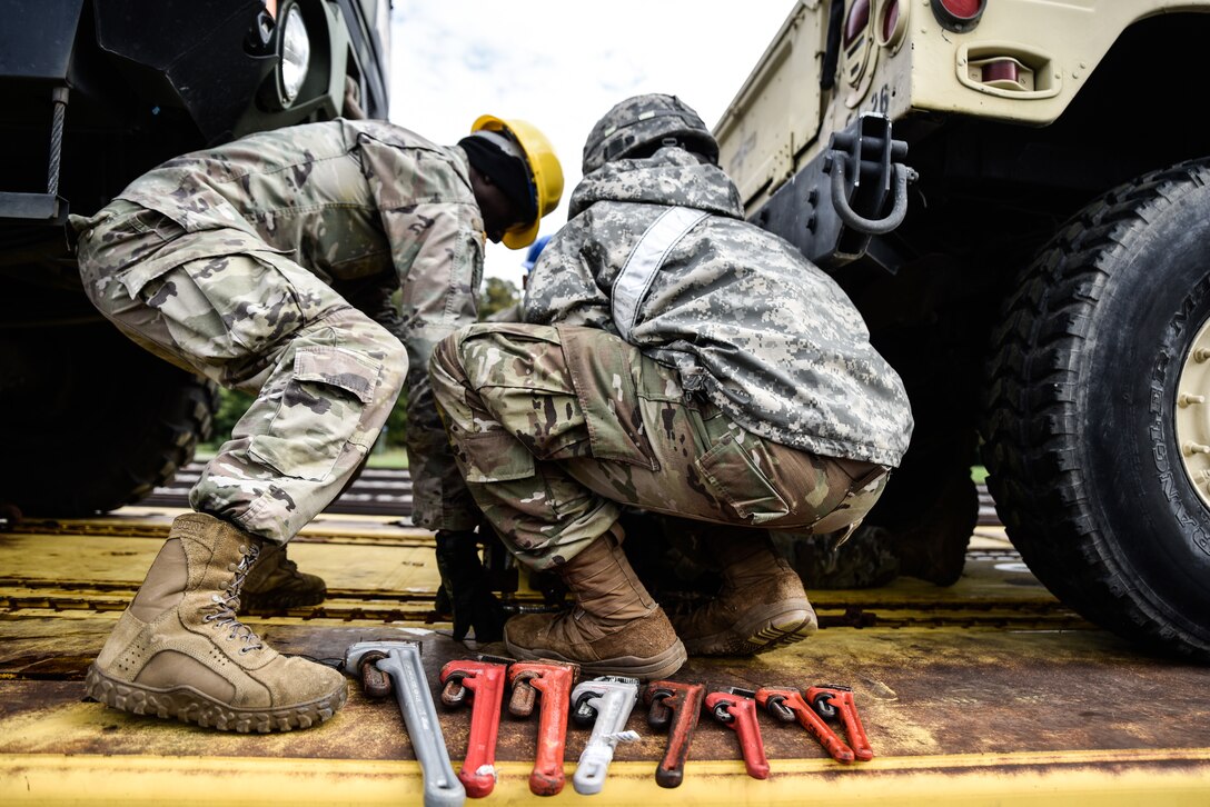 U.S. Army Soldiers from the 119th Inland Cargo Transfer Company, 11th Transportation Battalion, 7th Transportation Brigade (Expeditionary), conduct rail load operations during a training exercise at Joint Base Langley-Eustis, Virginia, Oct. 17, 2018.