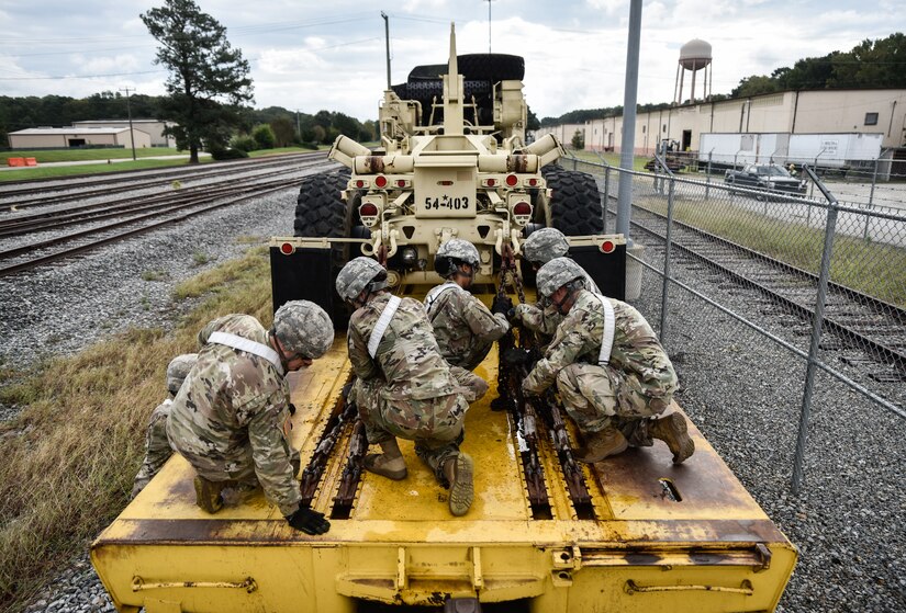 U.S. Army Soldiers from the 119th Inland Cargo Transfer Company, 11th Transportation Battalion, 7th Transportation Brigade (Expeditionary), conduct rail load operations during a training exercise at Joint Base Langley-Eustis, Virginia, Oct. 17, 2018.