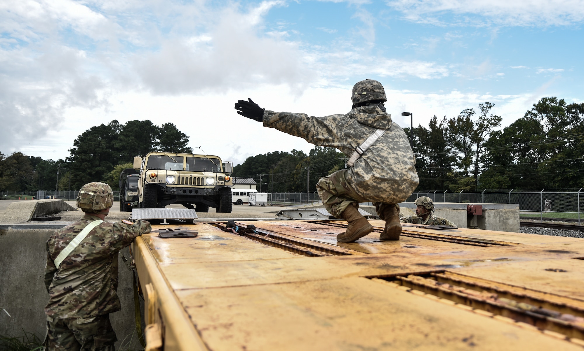 U.S. Army Soldiers from the 119th Inland Cargo Transfer Company, 11th Transportation Battalion, 7th Transportation Brigade (Expeditionary), conduct rail load operations during a training exercise at Joint Base Langley-Eustis, Virginia, Oct. 17, 2018.