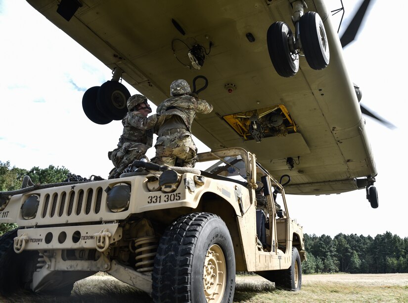 U.S. Army Soldiers from the 11th Transportation Battalion, 7th Transportation Brigade (Expeditionary), conduct sling load operations during a training exercise at Joint Base Langley-Eustis, Virginia, Oct. 17, 2018.