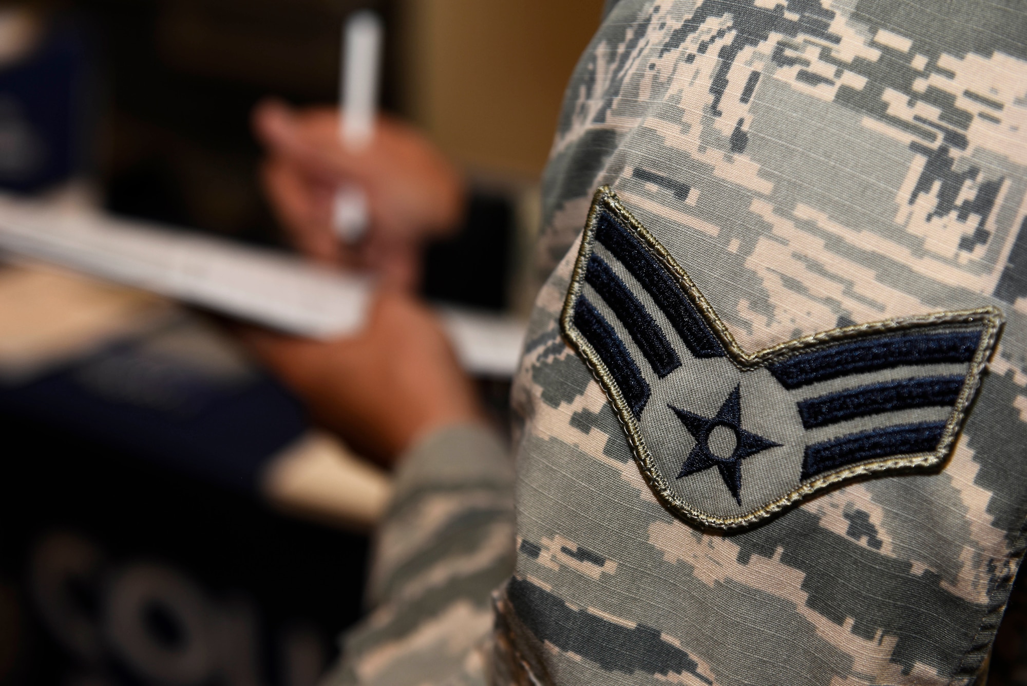 Senior Airman Adam Player, 92nd Communication Squadron communication security accountant, gathers information from a collegiate advisor during the 2018 Fairchild Air Force Base Education Fair at Fairchild Air Force Base, Washington, Oct. 18, 2018. The education fair hosted 27 different colleges as well as technical universities for Airmen and their families to engage with. (U.S. Air Force photo/Airman 1st Class Lawrence Sena)