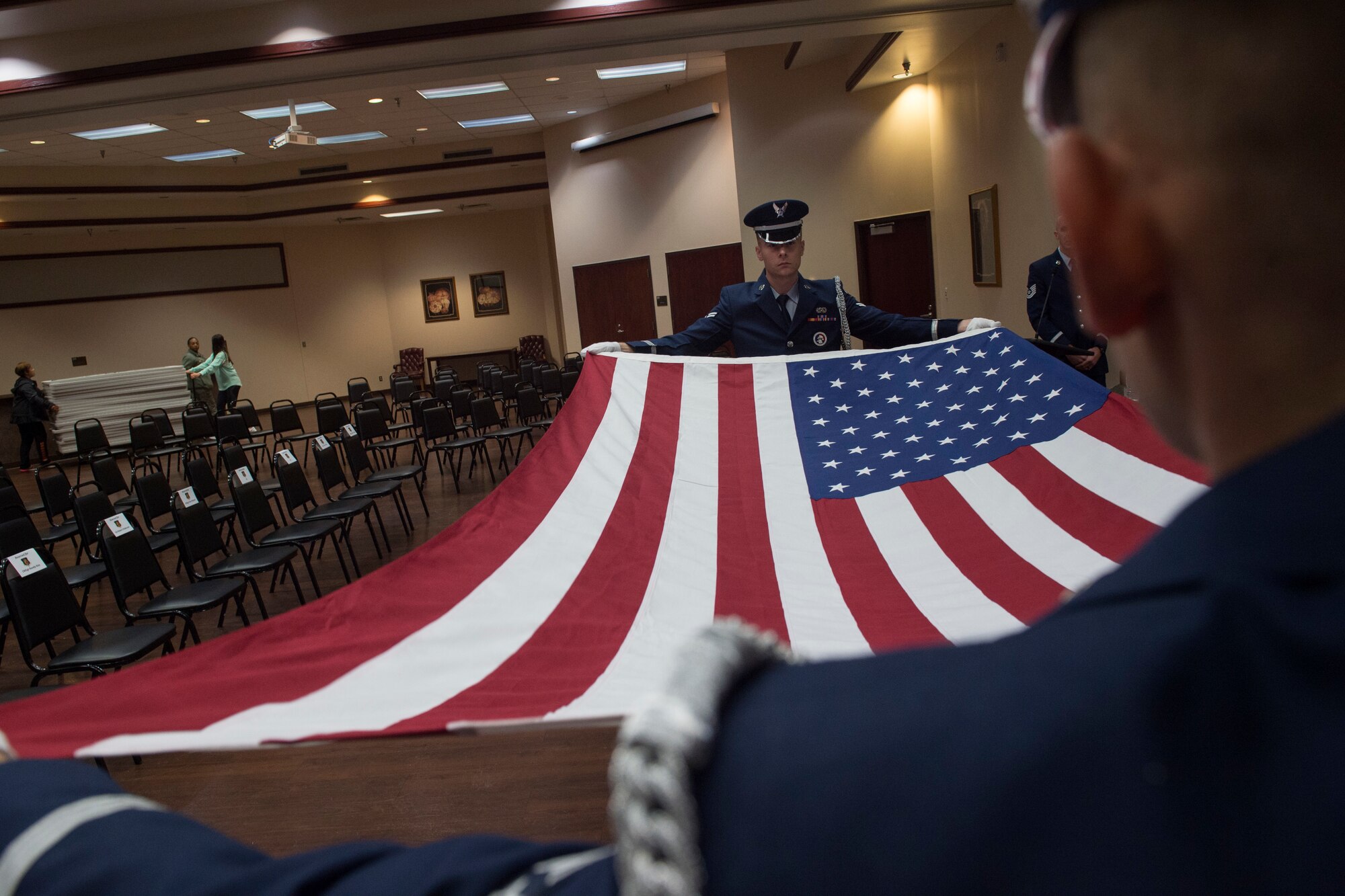 U.S. Air Force Airmen assigned to the 97th Air Mobility Wing Honor Guard team, fold the U.S. flag during a practice ceremony, Oct. 19, 2018, at Altus Air Force Base, Okla.