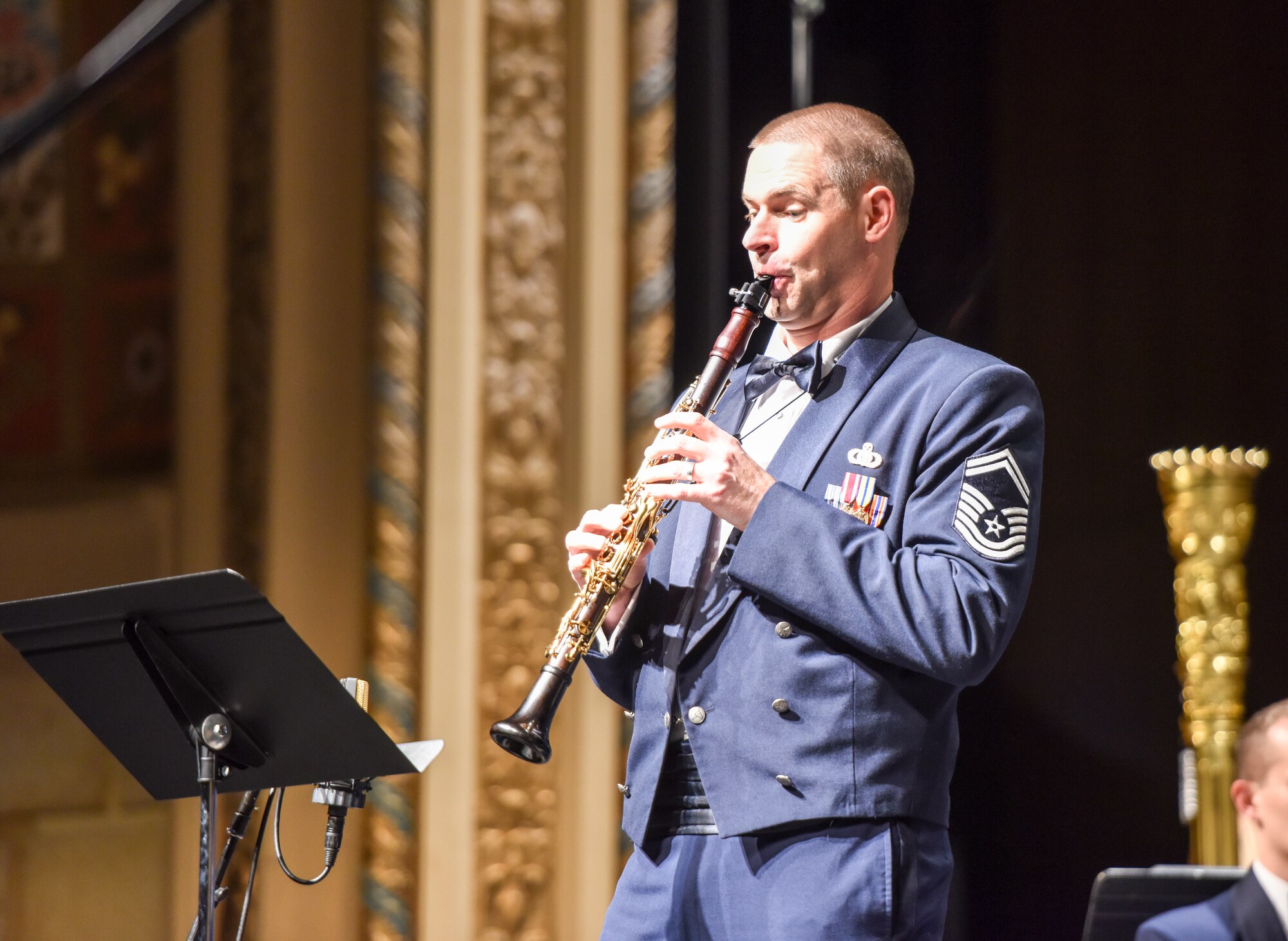 U.S. Air Force Senior Master Sgt. J. Blake Arrington, Air Force Concert Band premiere bandsman, performs a clarinet solo during the Air Force Band concert at the Murphey Performance Hall in San Angelo, Texas, Oct. 22, 2018. Arrington played “Nekudim” by Jonathan Leshnoff. (U.S. Air Force photo by Aryn Lockhart/Released)