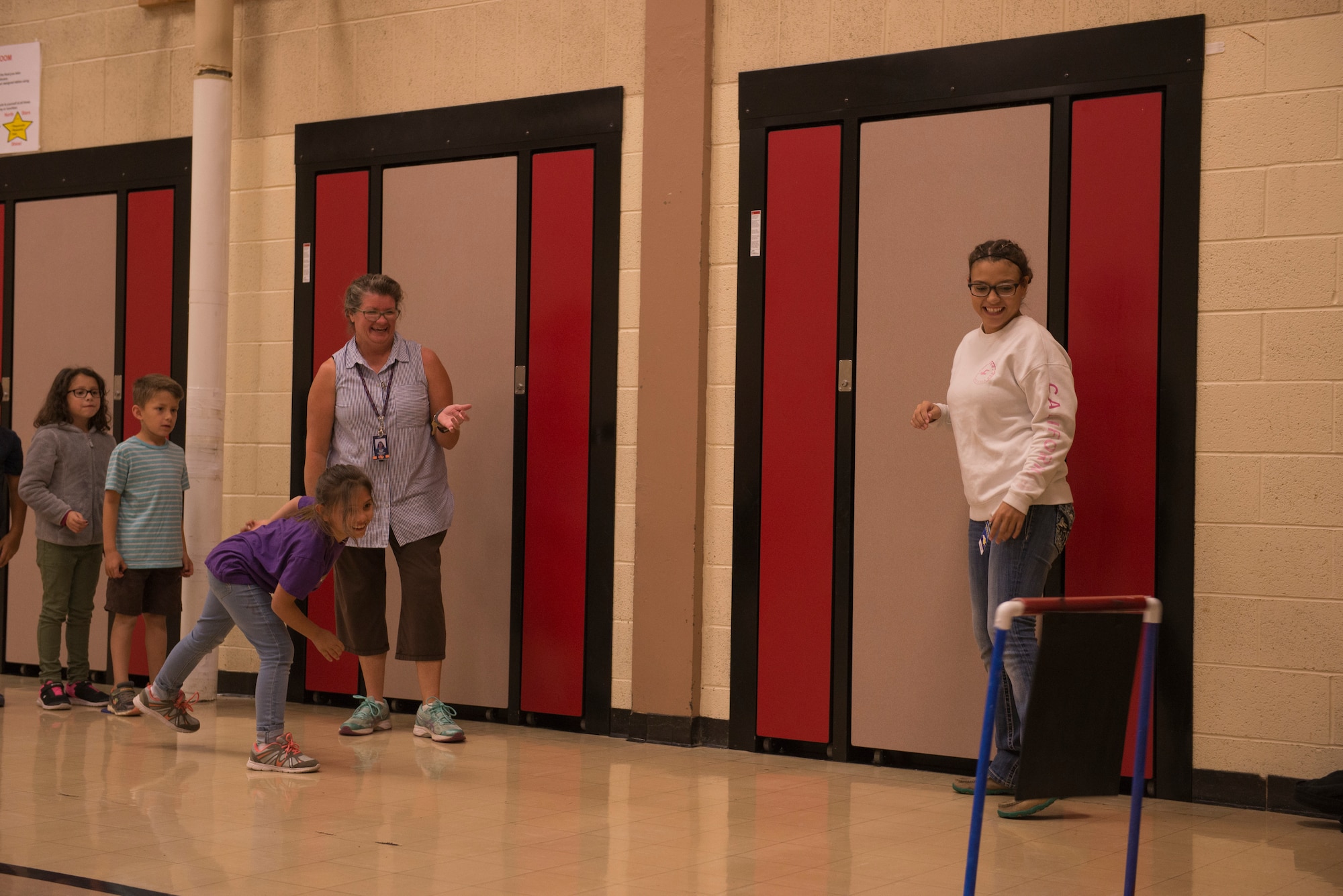 Airmen from the 366th Fighter Wing help students complete an obstacle course at North Elementary School, in Mountain Home, Idaho, October 4, 2018. North Elementary hosted their annual "Move-A-Thon" as a fundraiser for the students to go on field trips. (U.S. Air Force photo by Senior Airman Tyrell Hall)