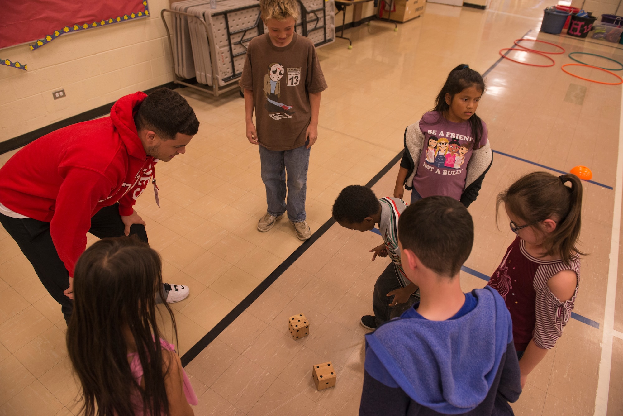 Airmen from the 366th Fighter Wing help students complete an obstacle course at North Elementary School, in Mountain Home, Idaho, October 4, 2018. North Elementary hosted their annual "Move-A-Thon" as a fundraiser for the students to go on field trips. (U.S. Air Force photo by Senior Airman Tyrell Hall)