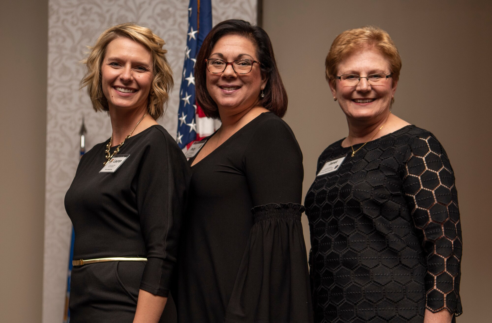 Alumni committee members Patty Barnett, Dr. Janet Fontenot, and Susan Holloway, pose for a photo during an Honorary Commander graduation and induction ceremony Oct. 19, 2018, at Scott Air Force Base, Illinois. The purpose of the alumni committee is to keep up the consistency of the program after the military commanders have been replaced. (U.S. Air Force photo by Senior Airman Melissa Estévez)