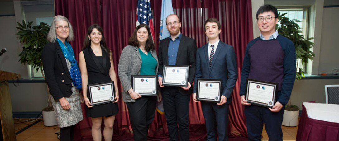 Research Director Deborah Frincke recognizes the 5th Annual Best Scientific Paper Competition winners for their contributions to cybersecurity research. (From left to right) Dr. Deborah Frincke, Ms. Yasemin Acar, Prof. Michelle L. Mazurek, Mr. Christian Stransky, Dr. Sascha Fahl, and Mr. Doowon Kim.