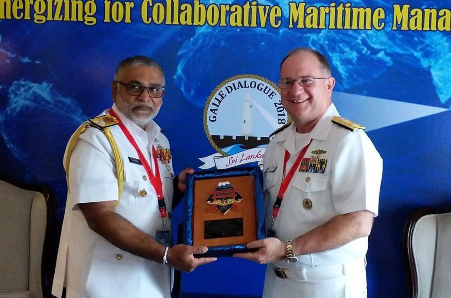 COLOMBO, Sri Lanka (Oct. 22, 2018) Rear Adm. Jimmy Pitts, Commander, Submarine Group 7 exchanges gifts with Sri Lanka Navy Commander Vice Adm. Sirimevan Ranasinghe during the 9th Annual International Maritime Conference "Galle Dialogue." Hosted by the Sri Lanka Navy (SLN), the two-day conference is one of the region’s premier venues to discuss maritime security issues amongst senior military and defense officials.  More than 140 delegates representing 52 countries and 22 international organizations and defense industries attended this year’s conference.
