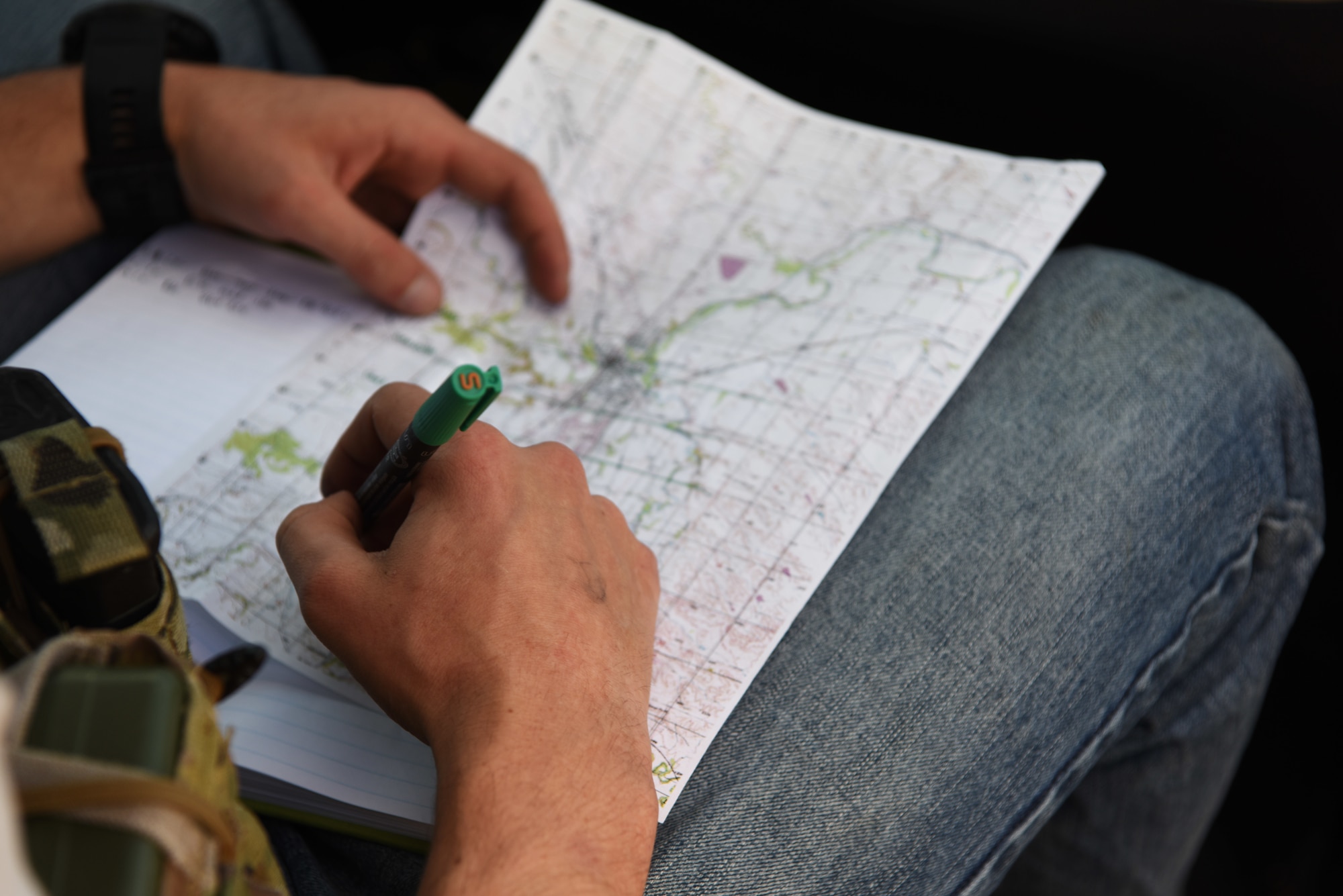 Senior Airman Steven, a 5th Air Support Operations Squadron joint terminal attack controller, puts coordinates on a map in Belle Fourche, S.D. on Oct. 17, 2018. JTACs from Joint Base Lewis-McChord, Wash., participated in Combat Raider 19-1, an exercise hosted by the 28th Bomb Wing, to train with bombers from all 8th Air Force bases. (U.S. Air Force photo by Airman 1st Class Thomas Karol)