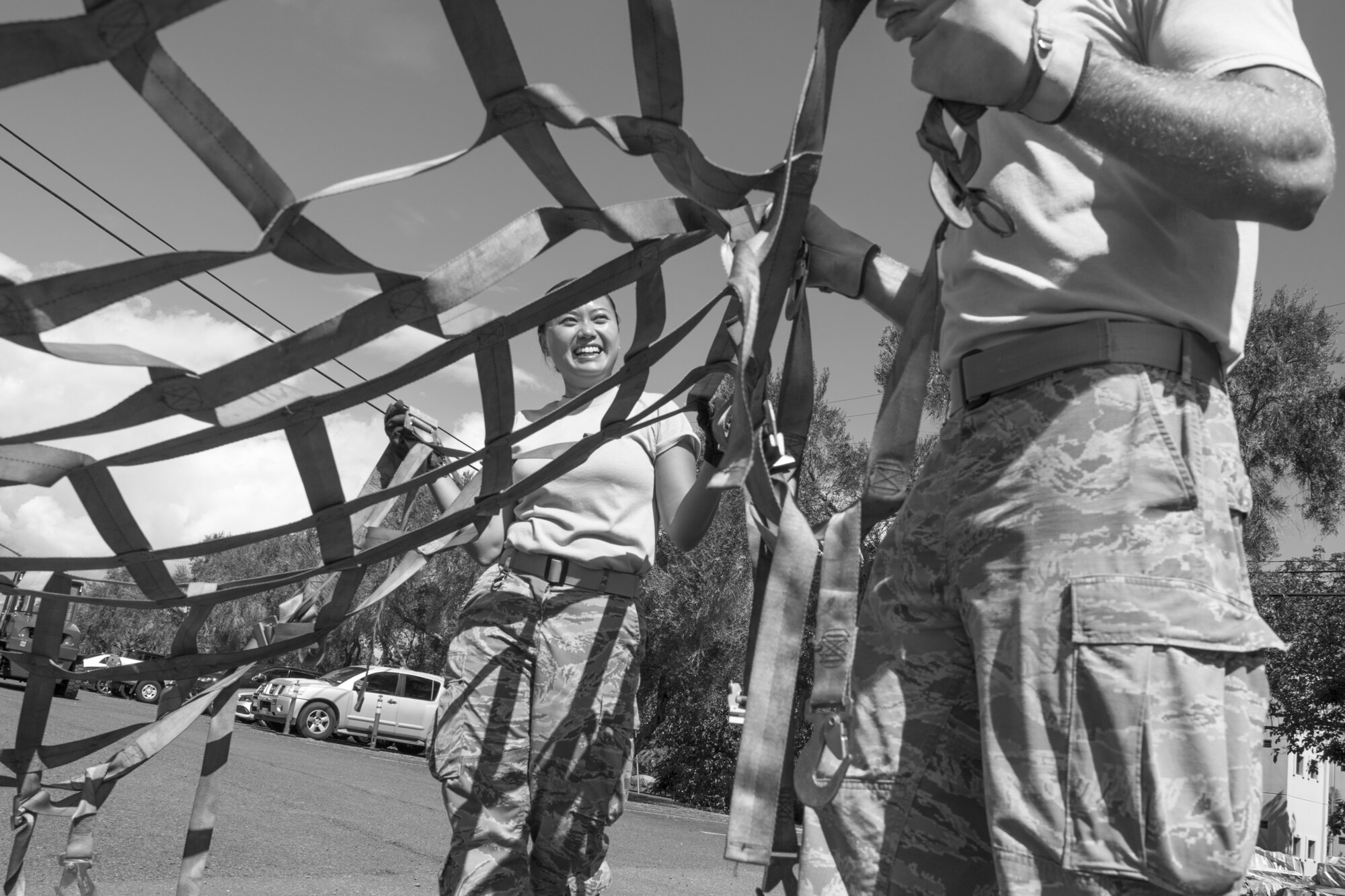 U.S. Air Force Staff Sergeant Hui Jin Kim, a member of the Air Force Reserve’s 48th Aerial Port Squadron, removes a cargo net from a pallet during a training exercise designed to perfect their pallet building skills as air transportation specialists Oct. 13, 2018, at Joint Base Pearl Harbor-Hickam, Hawaii. The 48th APS, which is part of the 624th Regional Support Group, deploys qualified personnel to provide air terminal operations worldwide in support of contingency operations, exercises, unit moves, and foreign humanitarian relief or disaster operations. (U.S. Air Force photo by Master Sgt. Theanne Herrmann)