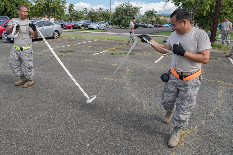 U.S. Air Force Master Sgt. Manuel Navalta and Staff Sgt. Jesse Garo, members of the Air Force Reserve’s 48th Aerial Port Squadron, participate in a teamwork exercise designed to perfect their skills as air transportation specialists Oct. 13, 2018, at Joint Base Pearl Harbor-Hickam, Hawaii. The 48th APS, which is part of the 624th Regional Support Group, deploys qualified personnel to provide air terminal operations worldwide in support of contingency operations, exercises, unit moves, and foreign humanitarian relief or disaster operations. (U.S. Air Force photo by Master Sgt. Theanne Herrmann)