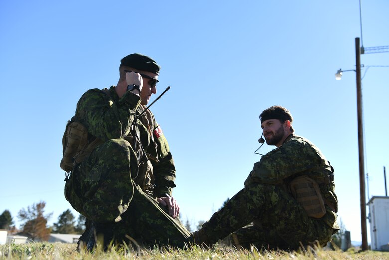 Capt. Chris Tymchuk, a joint tactical air controller troop commander assigned to the Royal Canadian Horse Artillery, 1st Regiment, relays coordinates to a B-1 while on the ground in Belle Fourche, S.D., Oct. 17, 2018. JTACs from the 1st RCHA assisted in Combat Raider 19-1, an exercise that helped them become familiar with the B-1 and its capabilities. (U.S. Air Force photo by Airman 1st Class Thomas Karol)