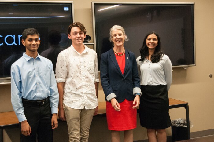 (l to r.) Karthik Yegnesh, runner-up; Charles Noyes, first place winner; Dr. Deborah Frincke, NSA Research Director; Rucha Joshi, runner-up