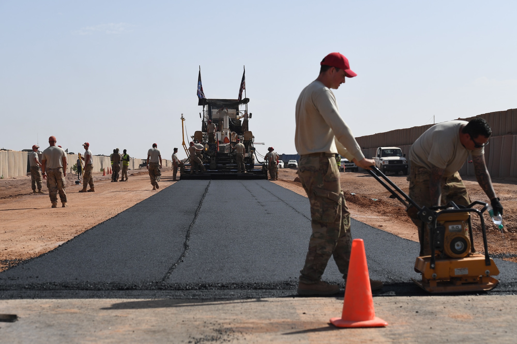 U.S. Air Force 31st Expeditionary Rapid Engineer Deployable Heavy Operation Repair Squadron Engineer Airmen prepare a flight line test strip to allow the engineers to test the asphalt and equipment to make adjustments before laying the runway. (U.S. Air Force photo by Tech. Sgt. Rachelle Coleman)
