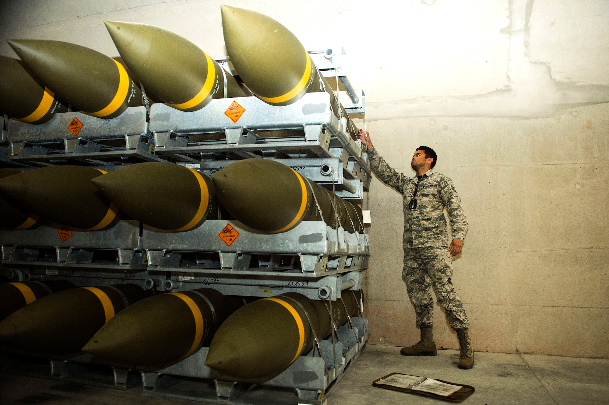 U.S. Air Force Staff Sgt. Jeric Hernandez, 86th Munitions Squadron quality assurance inspector, inspects a fresh shipment of large ordnance on Ramstein Air Base, Germany, Oct. 19, 2018. Ramstein recently received one of its largest munitions shipments in recent history. (U.S. Air Force photo by Senior Airman Joshua Magbanua)