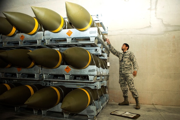 U.S. Air Force Staff Sgt. Jeric Hernandez, 86th Munitions Squadron quality assurance inspector, inspects a fresh shipment of large ordnance on Ramstein Air Base, Germany, Oct. 19, 2018. Ramstein recently received one of its largest munitions shipments in recent history. (U.S. Air Force photo by Senior Airman Joshua Magbanua)