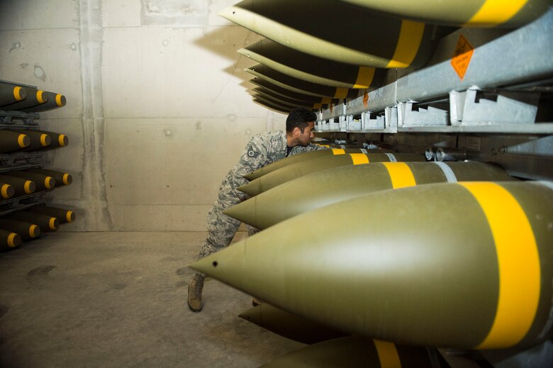 U.S. Air Force Staff Sgt. Jeric Hernandez, 86th Munitions Squadron quality assurance inspector, inspects a fresh shipment of large ordnance on Ramstein Air Base, Germany, Oct. 19, 2018. Munitions Airmen are responsible for receiving, inspecting, storing, and distributing munitions in support of global Air Force operations. (U.S. Air Force photo by Senior Airman Joshua Magbanua)