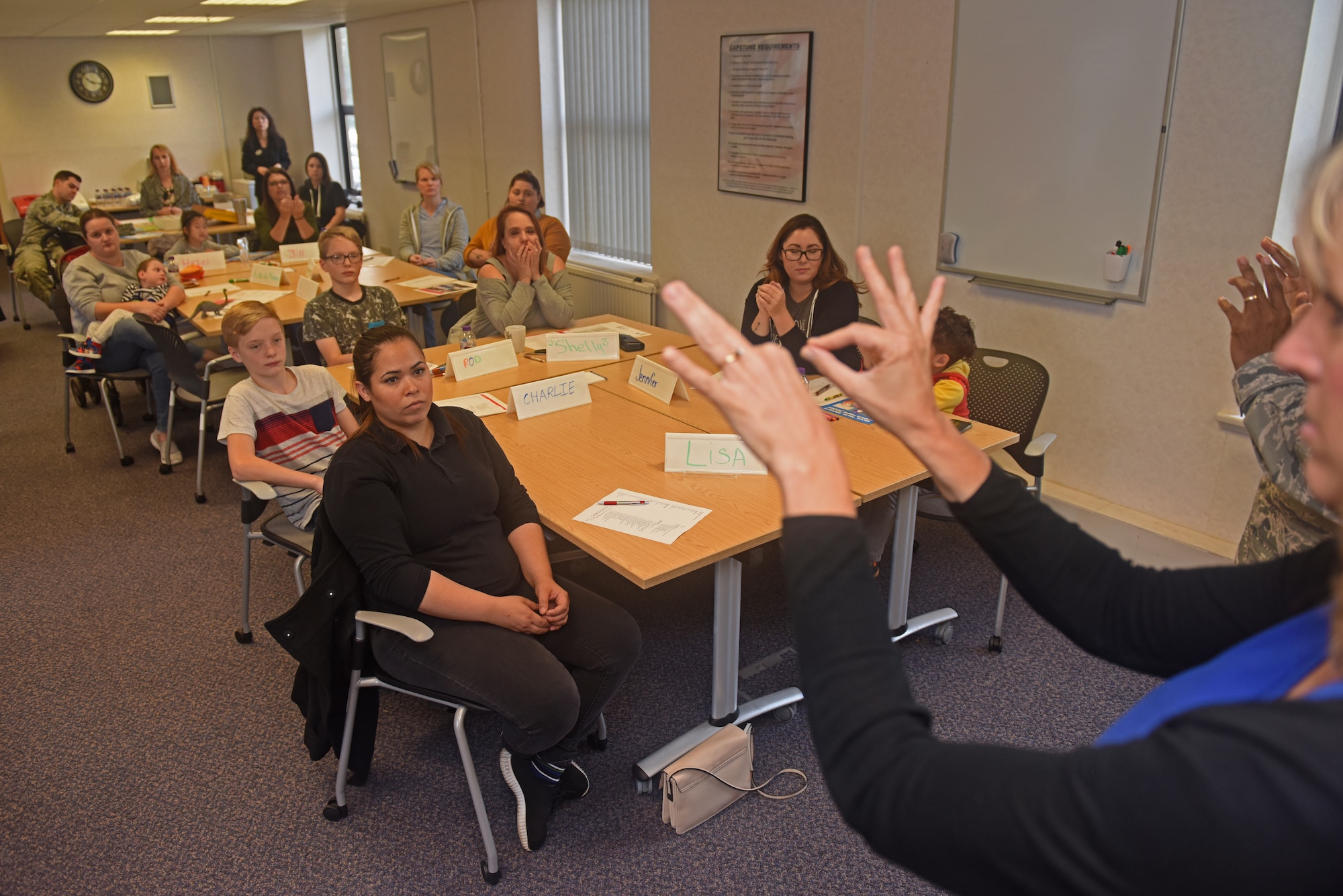 Ann Alexander, 100th Force Support Squadron sign language interpreter, goes over basic American Sign Language gestures during an ASL workshop at RAF Mildenhall, England, Oct. 23, 2018. The Airman and Family Readiness Center provided Airmen and families with the workshop in honor of National Disability Employment Awareness Month. (U.S. Air Force photo by Airman 1st Class Brandon Esau)