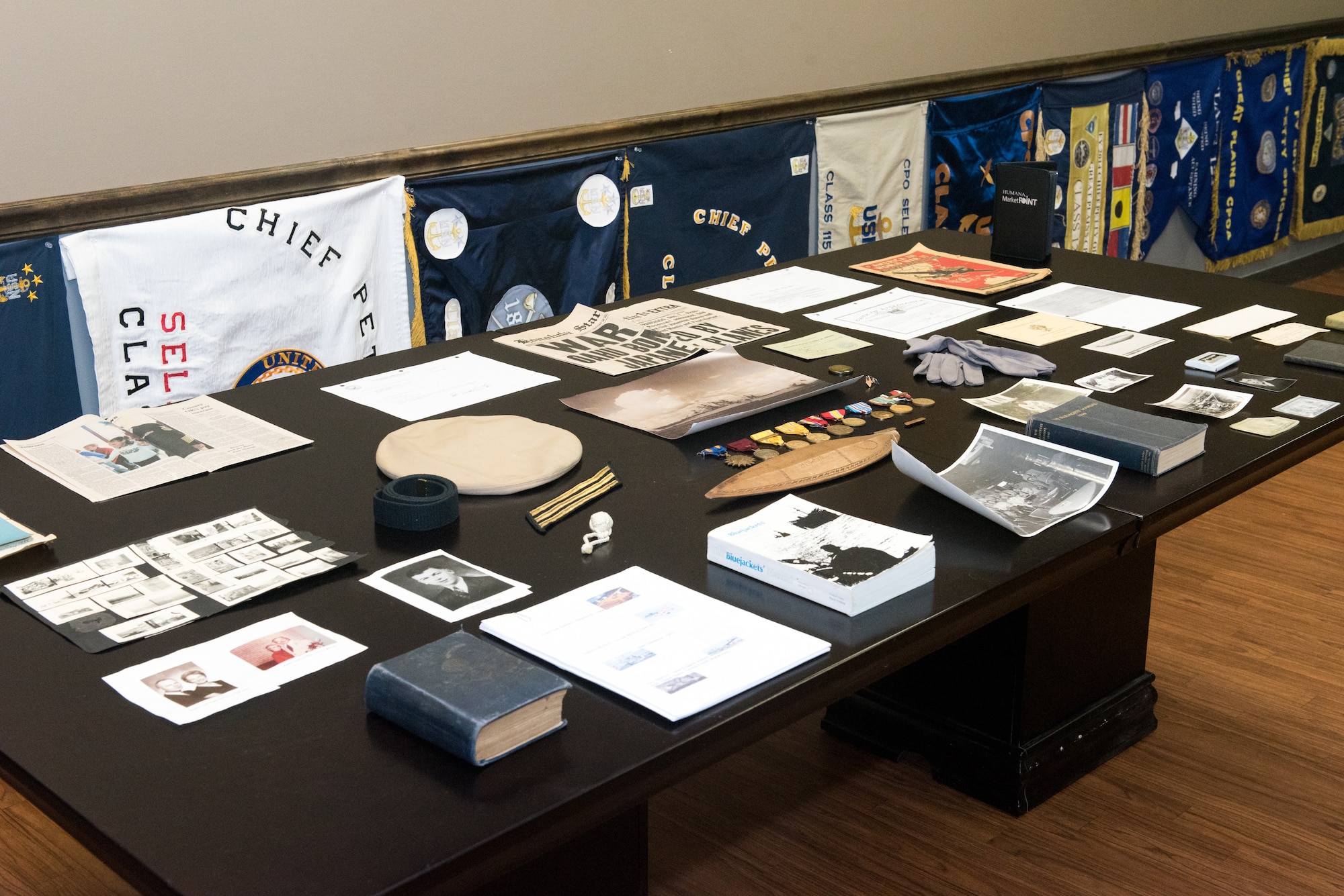 Mementos from U.S. Navy veteran and retired Chief Petty Officer John Sheeran are on display in the Great Plains Chief Petty Officer Association Chief’s Mess inside the 55th Operations Support Squadron Oct. 2018.